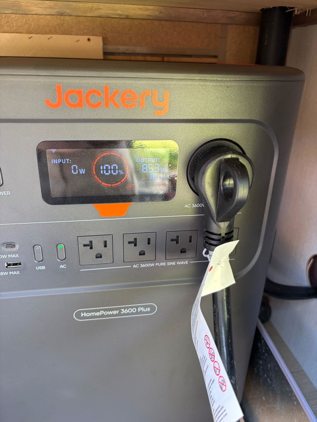 Front panel of an owner's Jackery HomePower 3600 Plus with a power cable plugged in